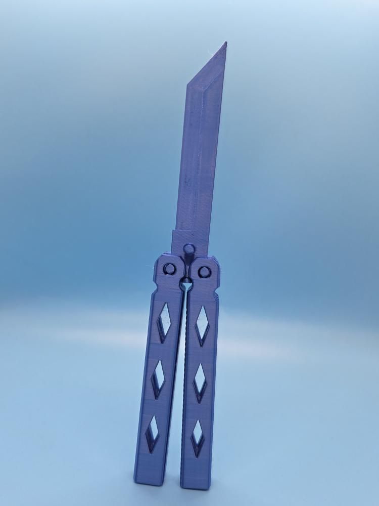 A fully functioning butterfly knife (REPLICA)